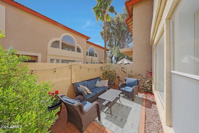 view of patio / terrace featuring a fenced backyard and an outdoor living space