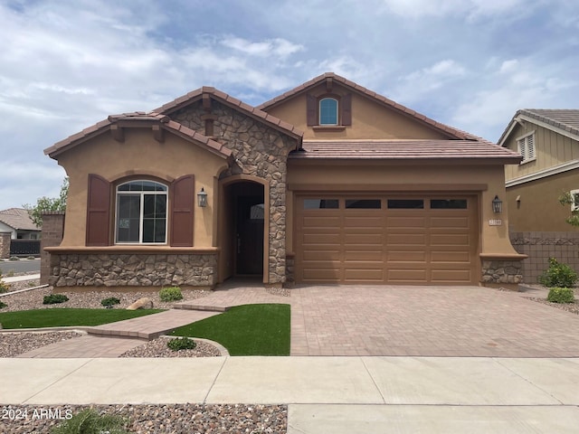 view of front of property with a garage