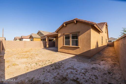 rear view of property featuring a patio