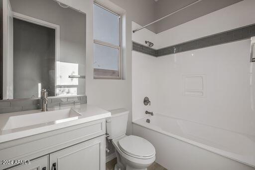 full bathroom featuring oversized vanity, toilet, and tub / shower combination