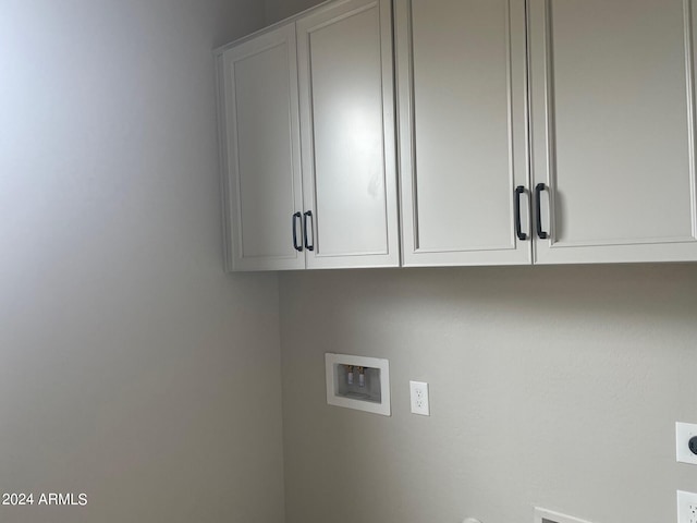 laundry room with cabinets, washer hookup, and hookup for an electric dryer