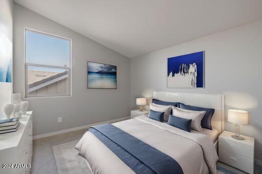 bedroom featuring lofted ceiling and carpet floors