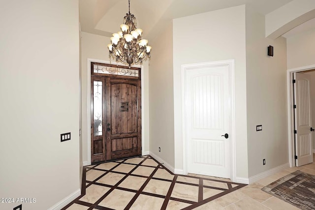 foyer featuring a chandelier