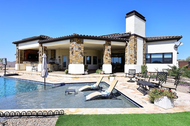 rear view of house with a patio