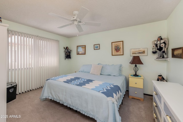 bedroom with light carpet and a ceiling fan