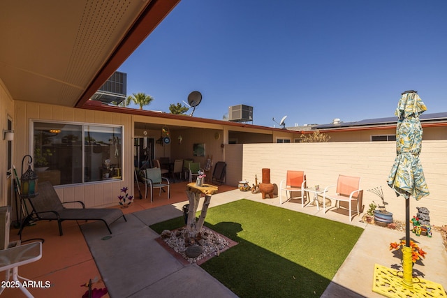 exterior space featuring fence, central AC, and a patio