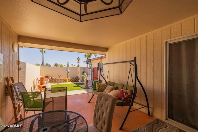 view of patio featuring outdoor dining area and a fenced backyard