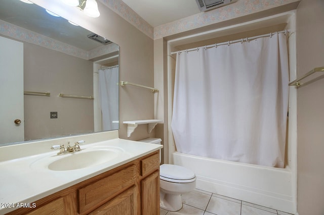 full bathroom with vanity, toilet, shower / bath combo with shower curtain, and tile patterned floors