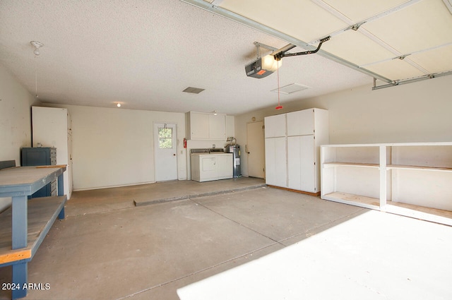 garage featuring water heater and a garage door opener