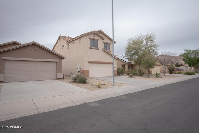 traditional home featuring roof mounted solar panels, driveway, stucco siding, and a garage
