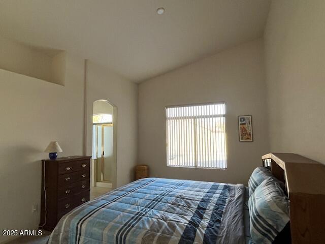 bedroom featuring vaulted ceiling