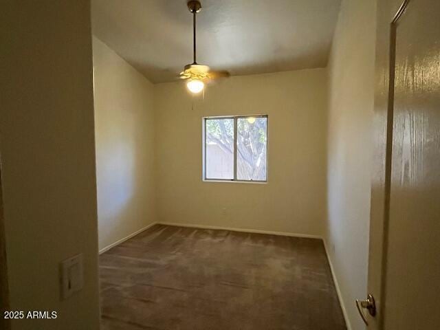 empty room featuring dark carpet