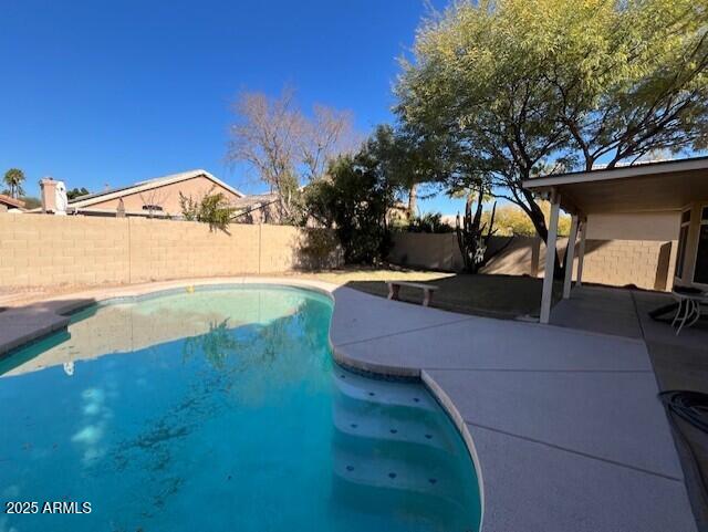 view of swimming pool featuring a patio area