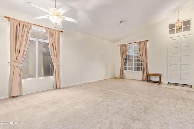 unfurnished room featuring ceiling fan, lofted ceiling, and carpet floors