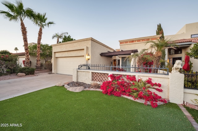 view of front facade featuring a garage and a front yard