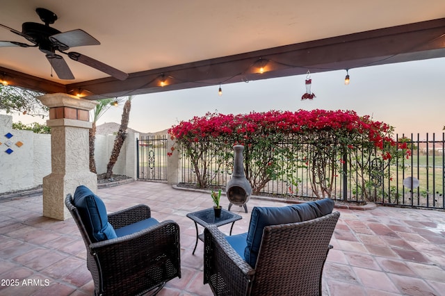 patio terrace at dusk with ceiling fan