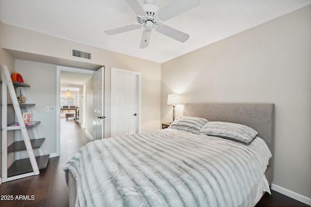 bedroom featuring ceiling fan and dark hardwood / wood-style flooring