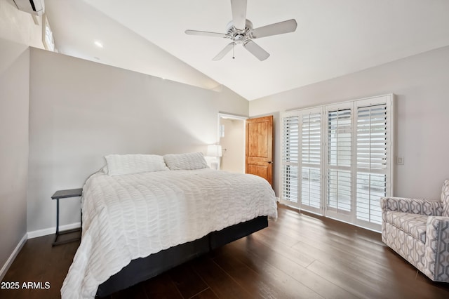 bedroom featuring lofted ceiling, a wall mounted air conditioner, dark hardwood / wood-style flooring, ceiling fan, and access to exterior