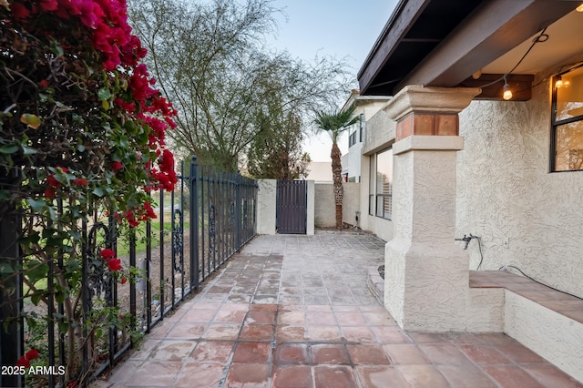 view of patio terrace at dusk