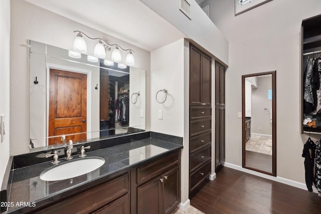 bathroom with vanity and hardwood / wood-style floors