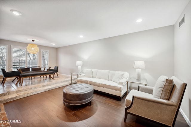 living room with dark hardwood / wood-style flooring