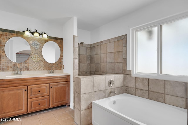 bathroom featuring vanity, a bathing tub, and tile patterned flooring