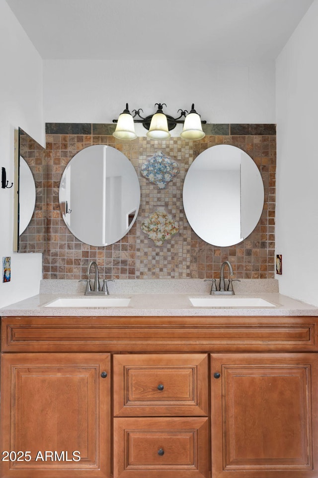 bathroom featuring vanity and decorative backsplash