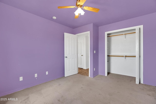 unfurnished bedroom with light colored carpet, a closet, and ceiling fan