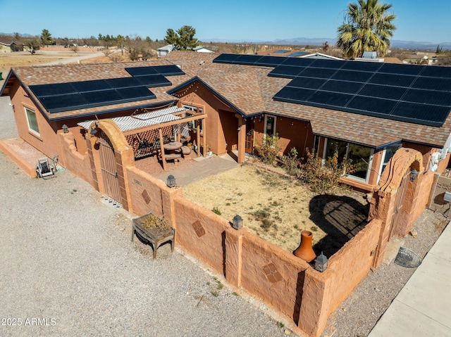 view of front of house with solar panels