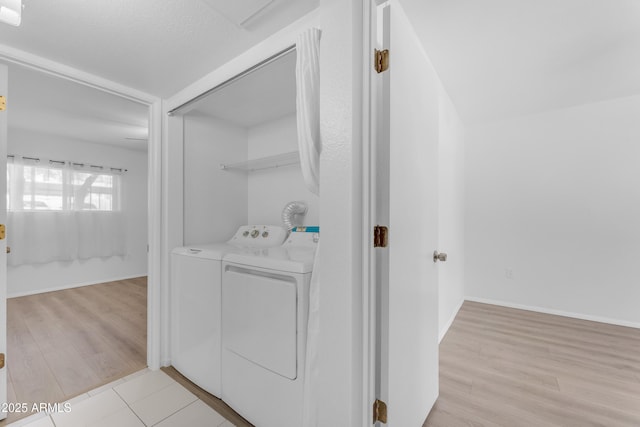 461 W Holmes Ave Unit 180, Mesa, AZ 85210 - washroom featuring washing machine and clothes dryer and light wood finished floors