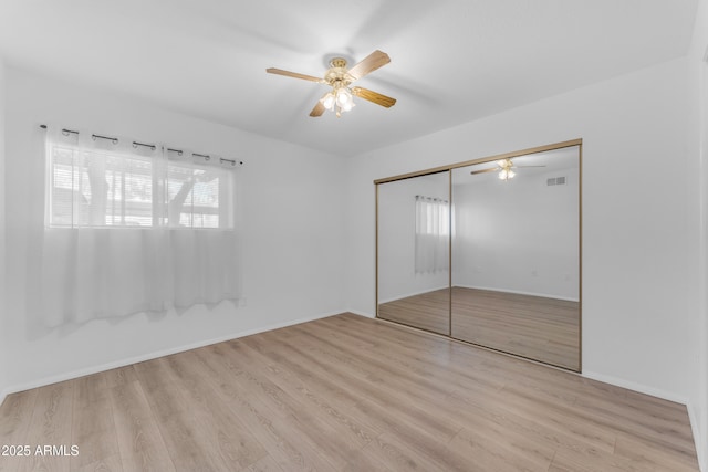 461 W Holmes Ave Unit 180, Mesa, AZ 85210 - unfurnished bedroom featuring wood finished floors, a closet, and ceiling fan
