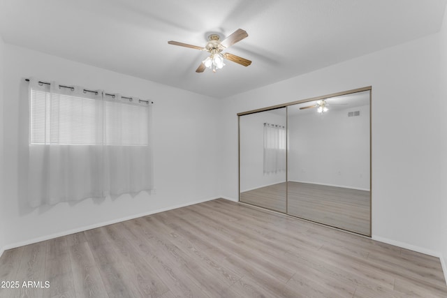 461 W Holmes Ave Unit 180, Mesa, AZ 85210 - unfurnished bedroom with wood finished floors, a closet, and ceiling fan