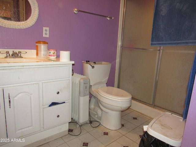 2045 S 6th Ave, Phoenix, AZ 85003 - full bathroom with toilet, radiator heating unit, tile patterned flooring, and a stall shower