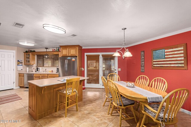 dining room with light tile patterned floors, a chandelier, and ornamental molding