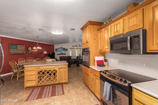 kitchen featuring lofted ceiling, crown molding, hanging light fixtures, appliances with stainless steel finishes, and light tile patterned floors