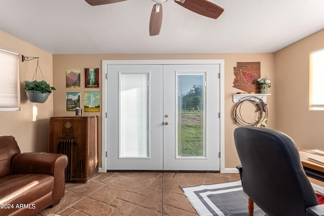 doorway with ceiling fan and french doors