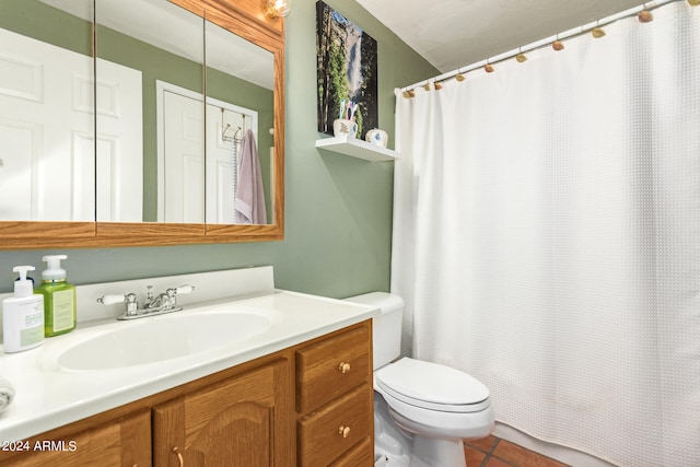 bathroom with tile patterned floors, toilet, and vanity