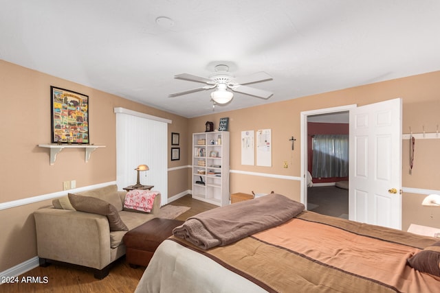 bedroom with ceiling fan and hardwood / wood-style floors