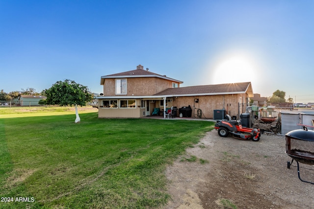 exterior space featuring a yard and a patio area