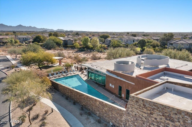 drone / aerial view featuring a mountain view and a residential view