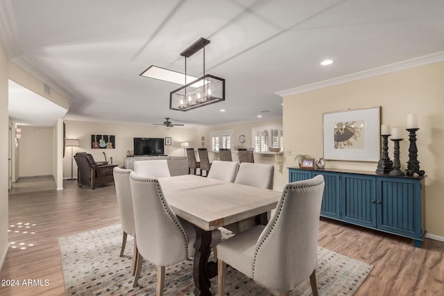 dining room with ceiling fan, dark hardwood / wood-style flooring, and ornamental molding