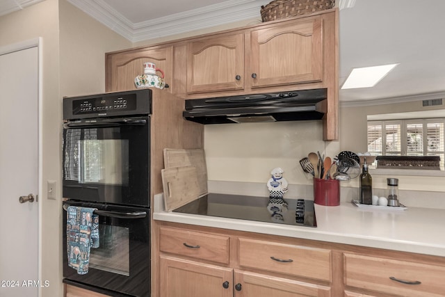 kitchen with a skylight, crown molding, light brown cabinetry, and black appliances