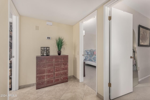 hallway featuring light tile patterned flooring