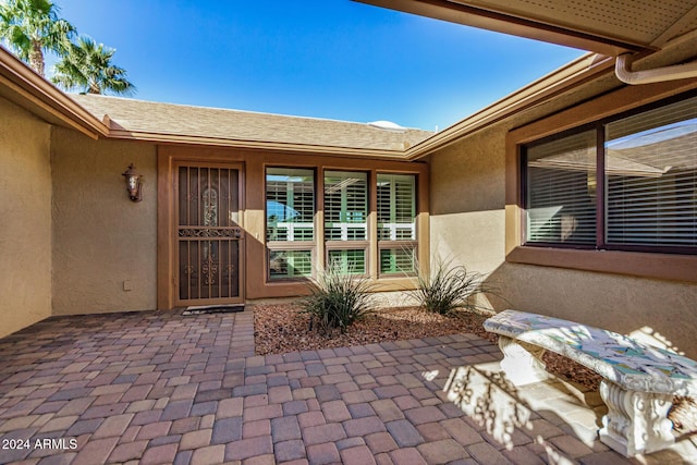 doorway to property featuring a patio