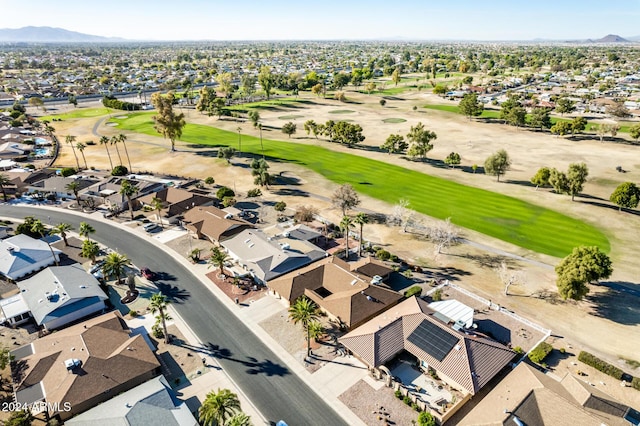 birds eye view of property with a mountain view