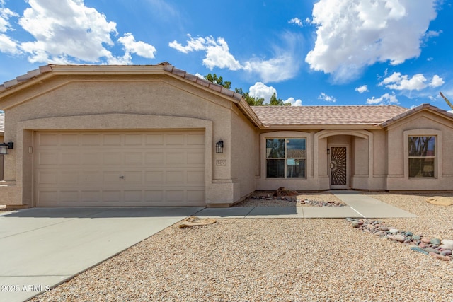 6372 S Callaway Dr, Chandler, AZ 85249 - ranch-style house with a garage, driveway, stucco siding, and a tiled roof