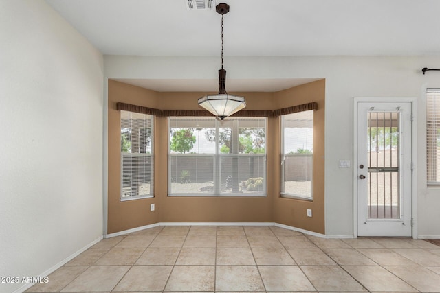 6372 S Callaway Dr, Chandler, AZ 85249 - unfurnished dining area with light tile patterned floors, baseboards, and visible vents