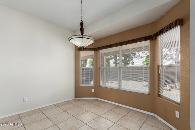 6372 S Callaway Dr, Chandler, AZ 85249 - unfurnished dining area featuring light tile patterned floors and baseboards