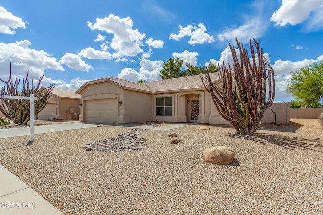 6372 S Callaway Dr, Chandler, AZ 85249 - view of front facade with driveway, a garage, stucco siding, and fence