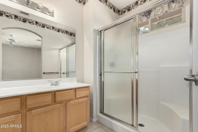 6372 S Callaway Dr, Chandler, AZ 85249 - bathroom featuring vanity, a stall shower, tile patterned flooring, a ceiling fan, and visible vents